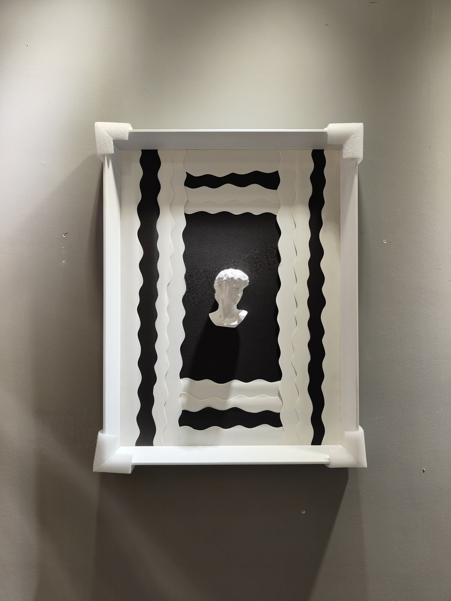 Sculptural Wall Art 50×70 – Black Base with White Frame & Bust Motif