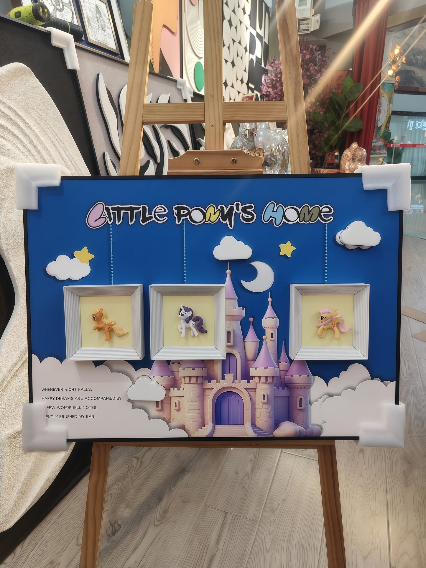 Wall-mounted pony art with fantasy castle scene