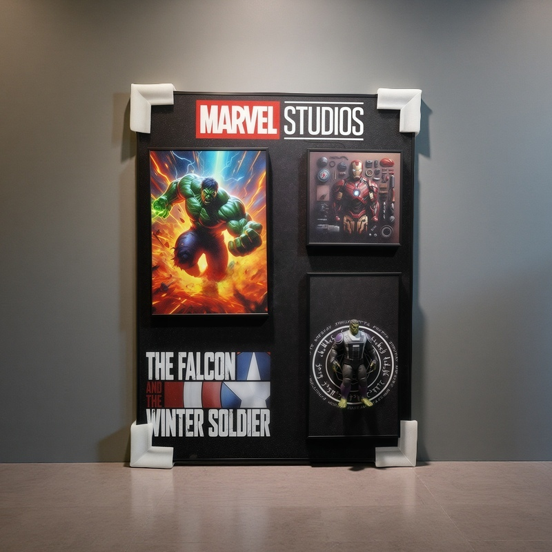 Marvel Studios 3D wall art featuring Hulk, Iron Man tech poster, and Hulk figurine inside a mystical ring. The Falcon and the Winter Soldier logo included.