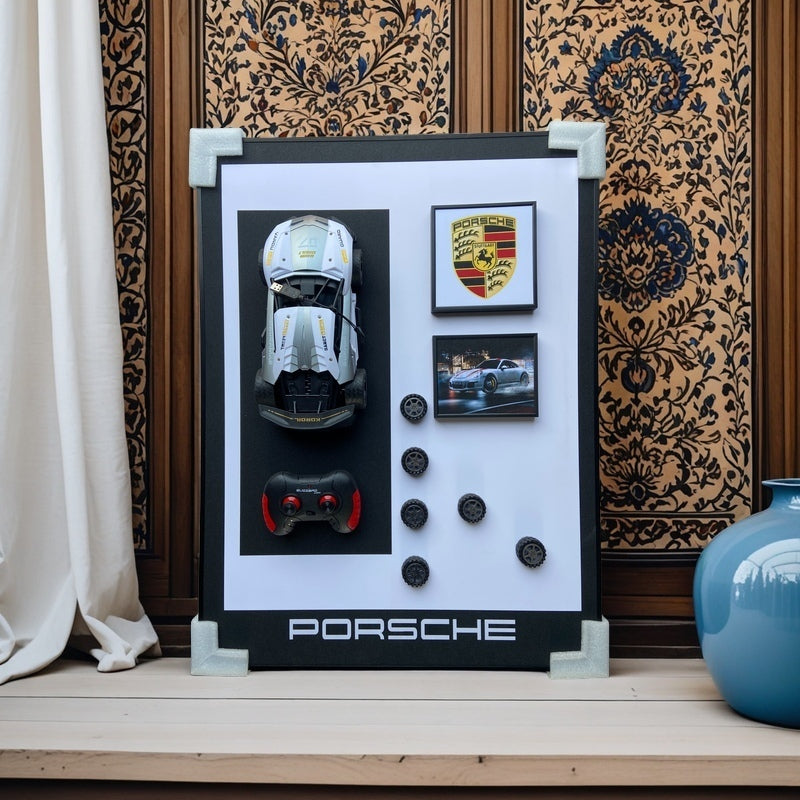 Porsche 3D RC car wall art with emblem, remote, wheels, and sports car image – modern decor for car enthusiasts