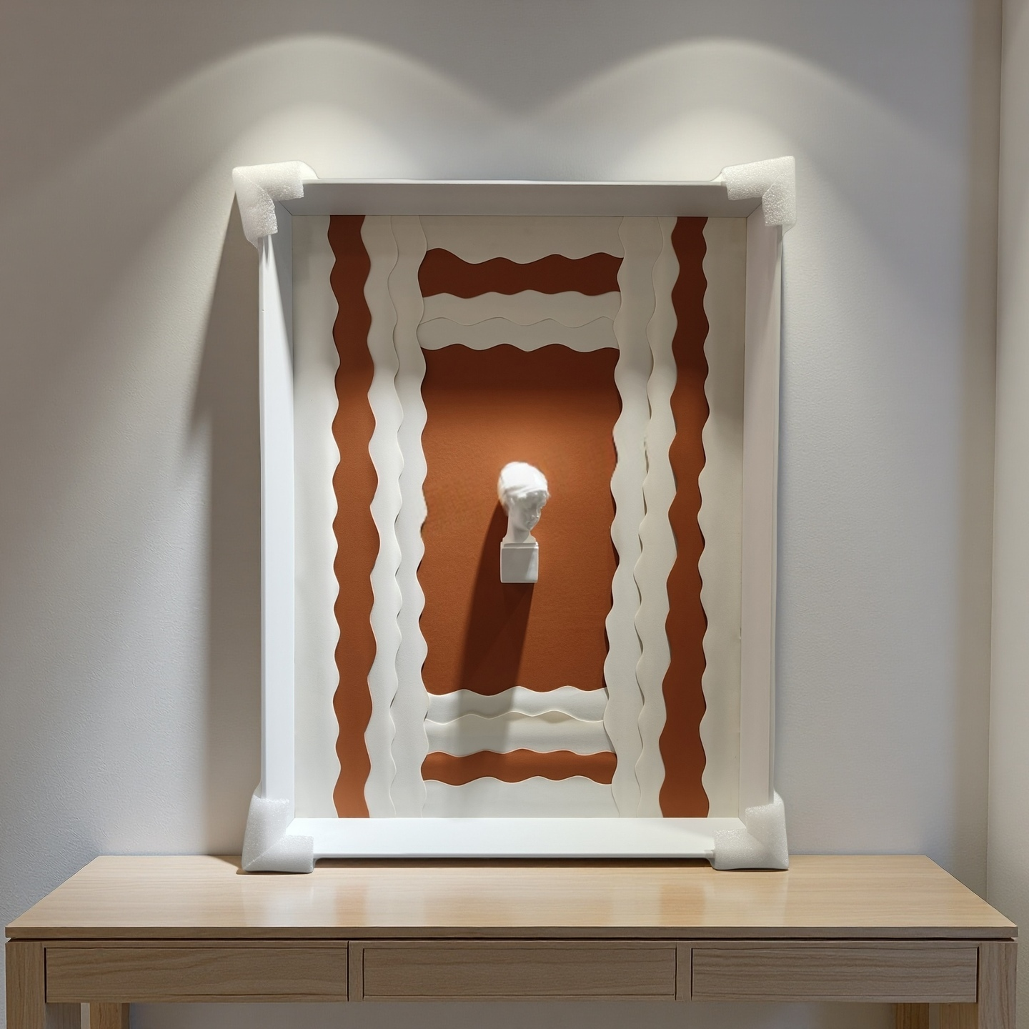 3D sculptural bust wall art with terracotta wave background and white frame – 50×70cm