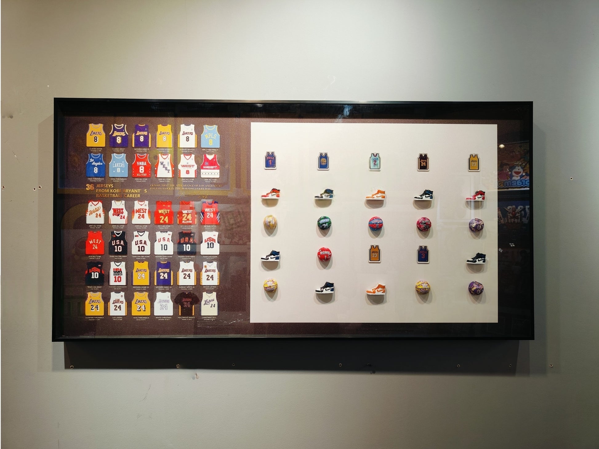 Framed 3D Kobe Bryant wall art featuring 36 jerseys, sneakers, and basketballs in a 60×120cm display.
