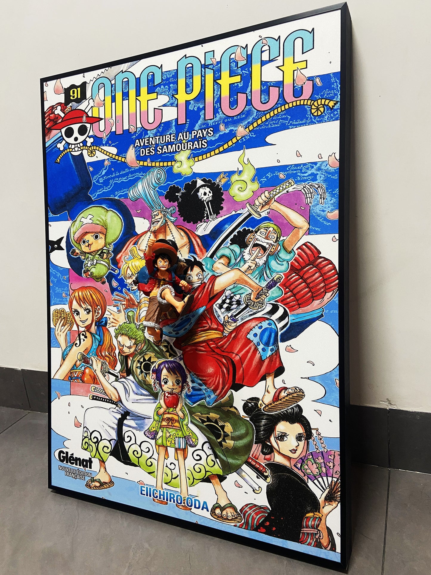 One Piece 3D wall art featuring Luffy figurine and vibrant manga poster design