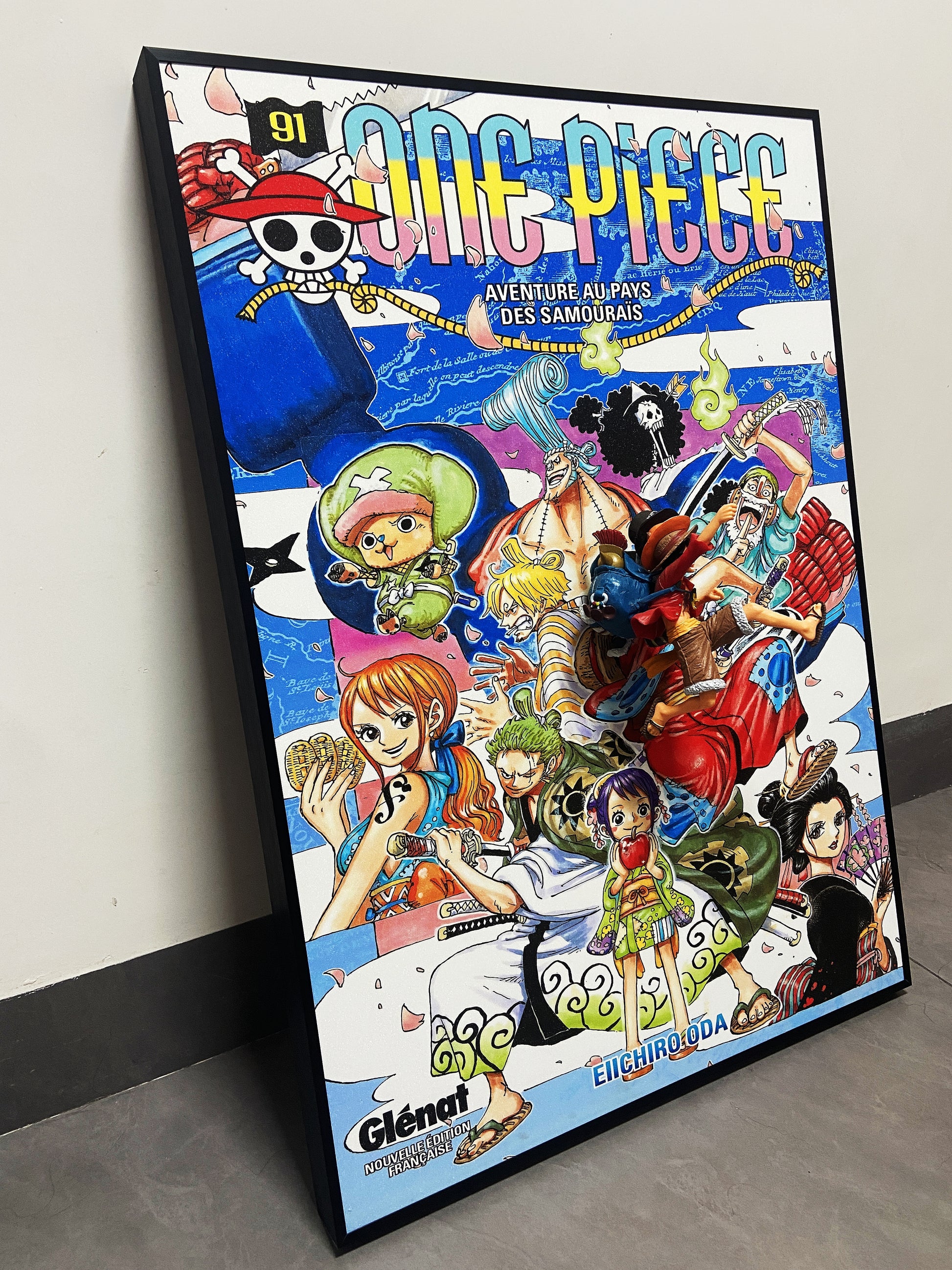 One Piece 3D wall art featuring Luffy figurine and vibrant manga poster design