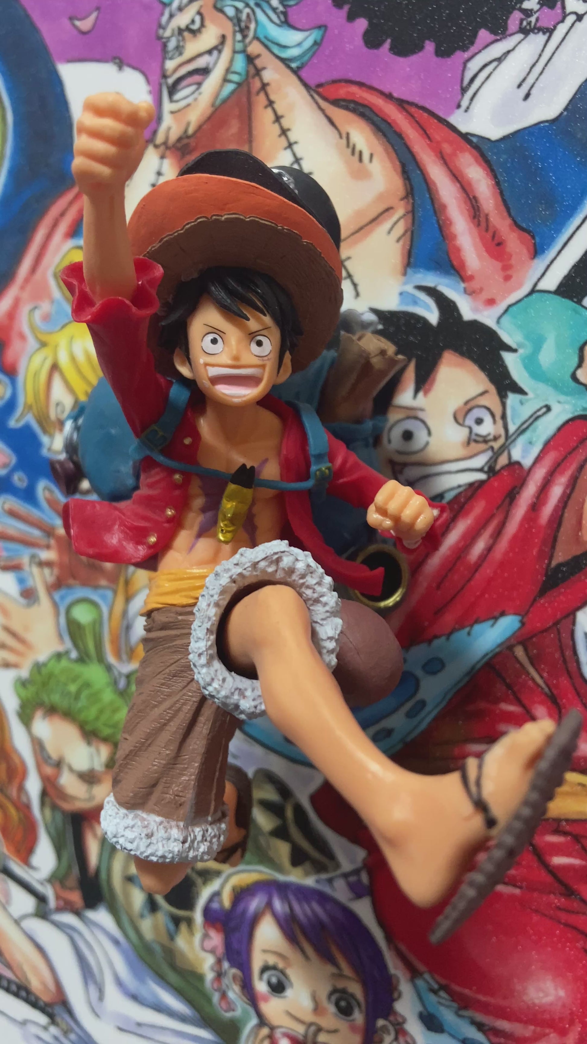One Piece 3D wall art featuring Luffy figurine and vibrant manga poster design