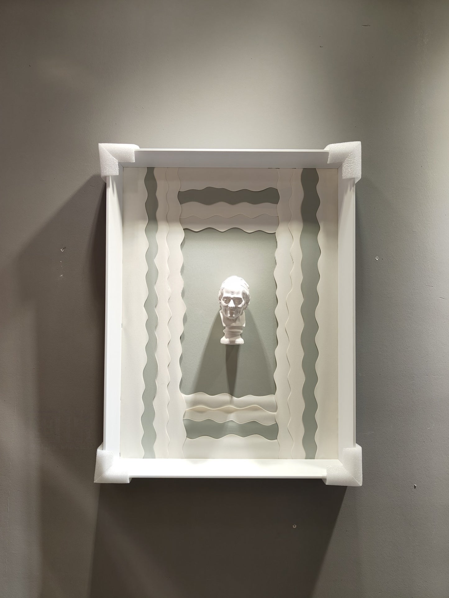 50×70cm framed wave-style wall art with white classical bust and mint backdrop