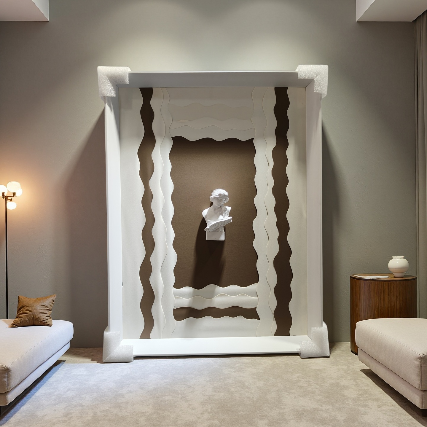 Minimalist wall art with wavy white frame and 3D plaster bust on taupe background

